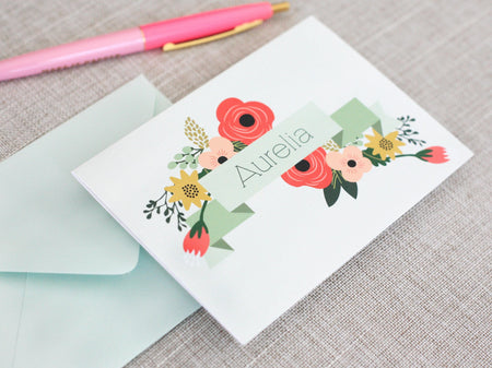 a greeting card with a pink pen on top of it