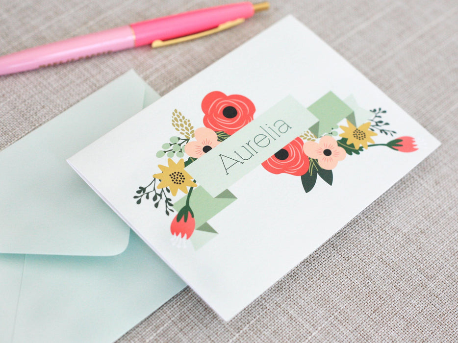 a greeting card with a pink pen on top of it