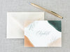 a note with a pen on top of it next to an envelope