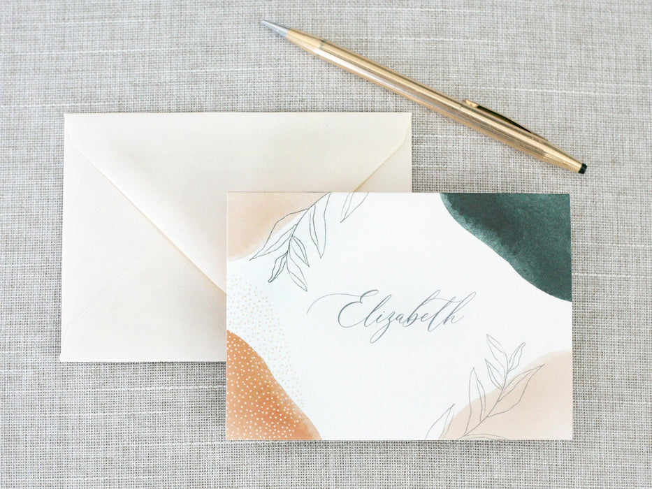 a note with a pen on top of it next to an envelope