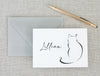 a card with a drawing of a cat on it