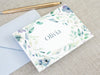 a close up of a note with a pen on top of it
