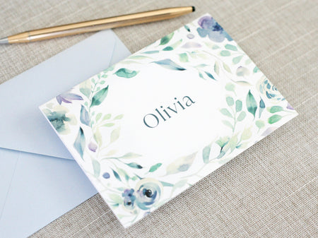 a close up of a note with a pen on top of it