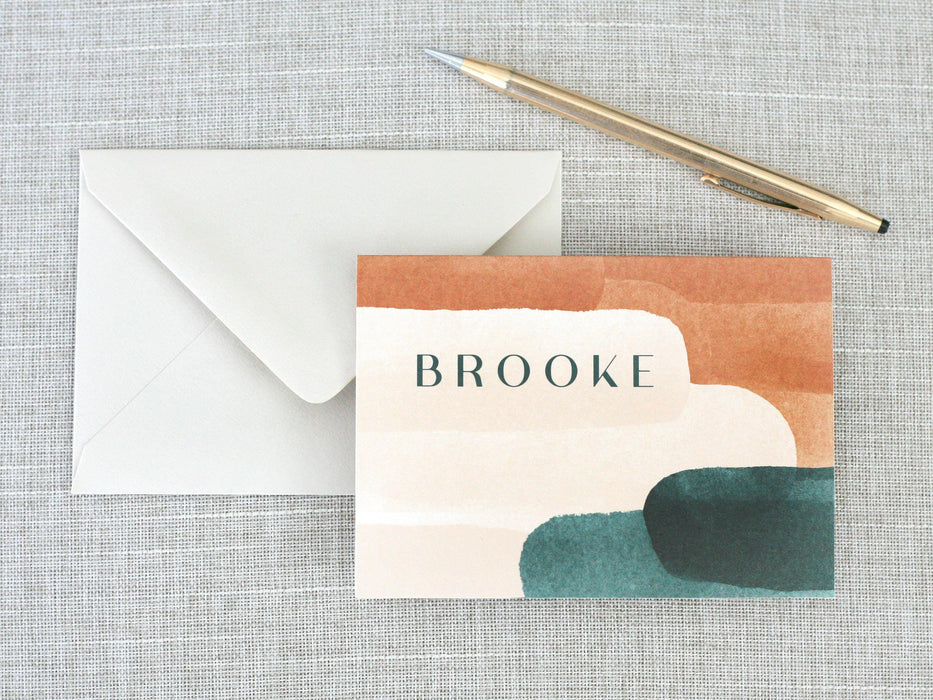 a card with the words brooke on it next to an envelope