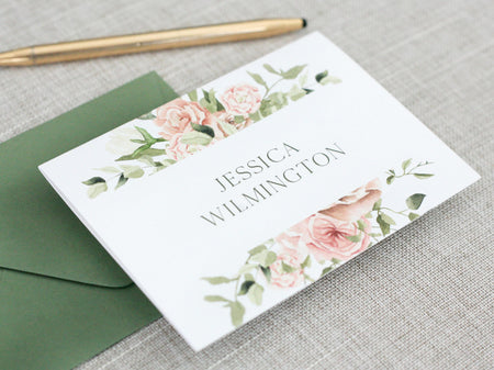 a close up of a card on a table with a pen