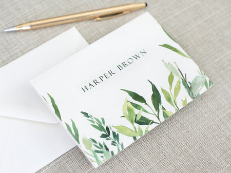 a close up of a note and a pen on a table