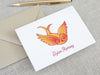 a card with a bird on it next to a pen